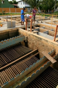 eunapolis, bahia / brazil - february 1, 2009: workers work to clean Embasa's water treatment plant in the city of Eunapolis.