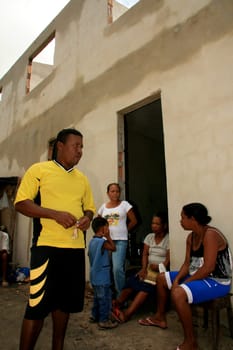 eunapolis, bahia / brazil - january 15, 2009: people who are members of the Association Residents Without a Roof are seen during the invasion of houses under construction, aimed at poor families in the city of Eunapolis....