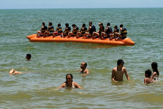 porto seguro, bahia / brazil - january 8, 2009: People are seen aboard a vessel known as a banana boat on the beach in the city of Porto Seguro.