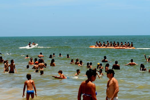 porto seguro, bahia / brazil - january 8, 2009: People are seen aboard a vessel known as a banana boat on the beach in the city of Porto Seguro.