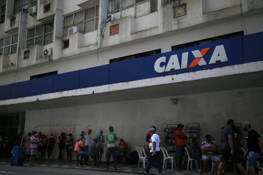 salvador, bahia / brazil - september 8, 2020: people face queues for assistance at Caixa Economica Federal in the neighborhood of Comercio, in the city of Salvador..