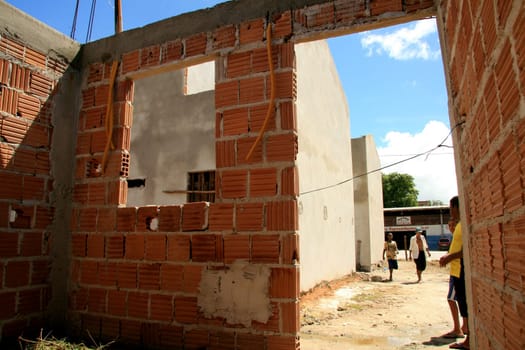 eunapolis, bahia / brazil - january 15, 2009: people who are members of the Association Residents Without a Roof are seen during the invasion of houses under construction, aimed at poor families in the city of Eunapolis....