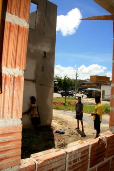 eunapolis, bahia / brazil - january 15, 2009: people who are members of the Association Residents Without a Roof are seen during the invasion of houses under construction, aimed at poor families in the city of Eunapolis....