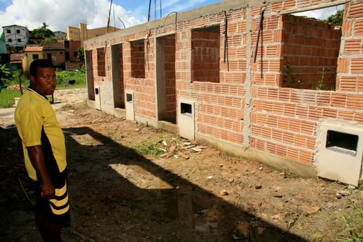 eunapolis, bahia / brazil - january 15, 2009: people who are members of the Association Residents Without a Roof are seen during the invasion of houses under construction, aimed at poor families in the city of Eunapolis....