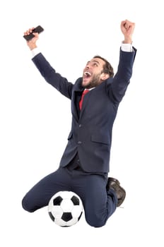Businessman with soccer ball celebrating isolated in white