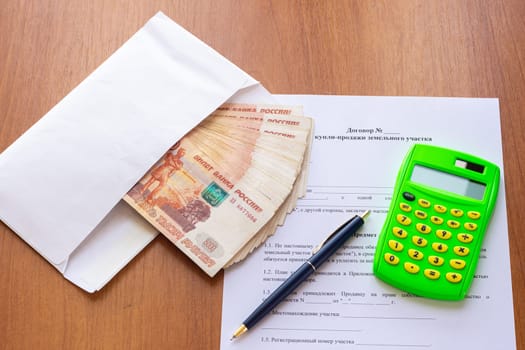 The concept of signing a purchase and sale agreement for a land plot