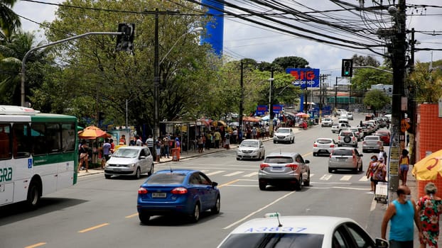 salvador, bahia / brazil - september 11, 2020: people and vehicles are seen on a street in the neighborhood of Cabula in the city of Salvador.