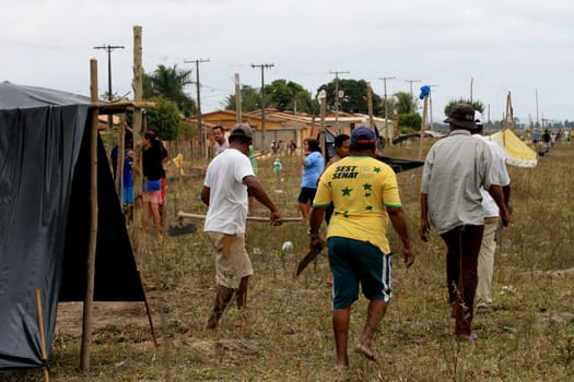 eunapolis, bahia / brazil - april 8, 2009: members of the Movimento Sente Terra - MST - are seen during the occupation of a farm invaded in the rural area of the municipality of Eunapolis....