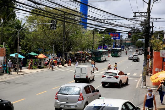 salvador, bahia / brazil - september 11, 2020: people and vehicles are seen on a street in the neighborhood of Cabula in the city of Salvador.