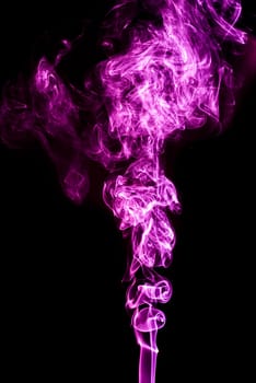 Violet abstract shaped smoke against black background. Abstract background. Selective focus