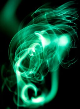 Red abstract shaped smoke against black background. Abstract background. Selective focus