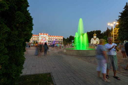 Anapa, Russia - July 17, 2020: Tourist-filled Soviets Square in Anapa, beautiful fountains in front of the city administration of the Anapa resort