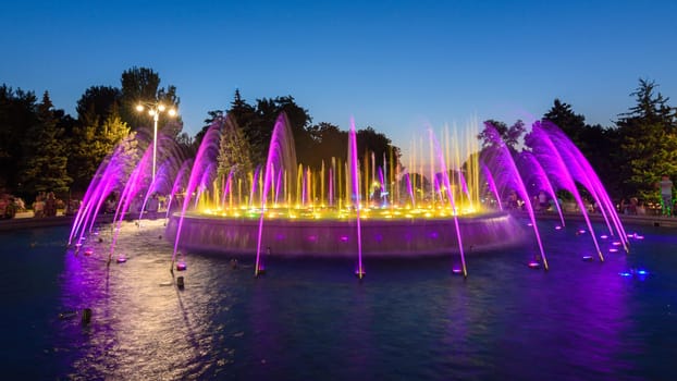 Anapa, Russia - July 17, 2020: Beautiful fountain after sunset close-up. The fountain is located near the building of the city administration of the Anapa resort