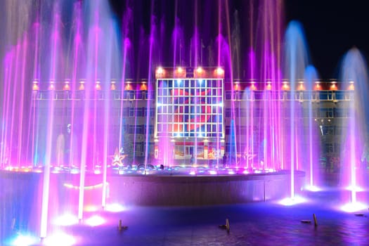 Anapa, Russia - July 17, 2020: View of the building of the administration of the city of the resort of Anapa through the nearby fountain