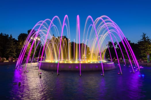 Anapa, Russia - July 17, 2020: A beautiful multi-colored fountain with high jets, located near the administration building in the city of Anapa resort
