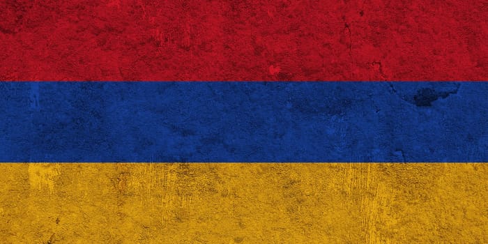 Flag of Armenia on weathered concrete