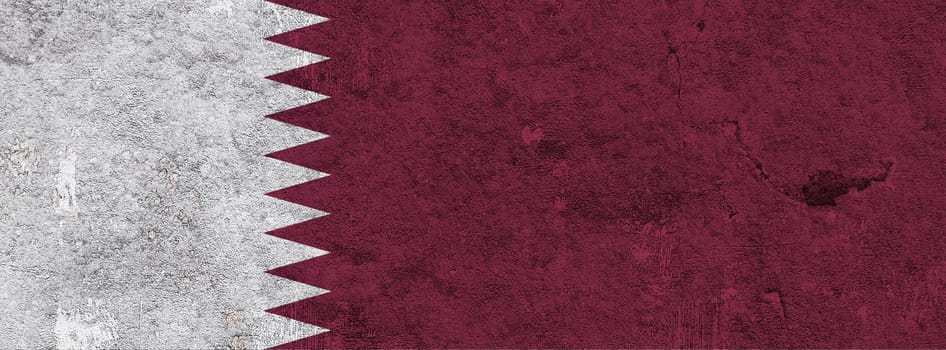 Flag of Qatar on weathered concrete