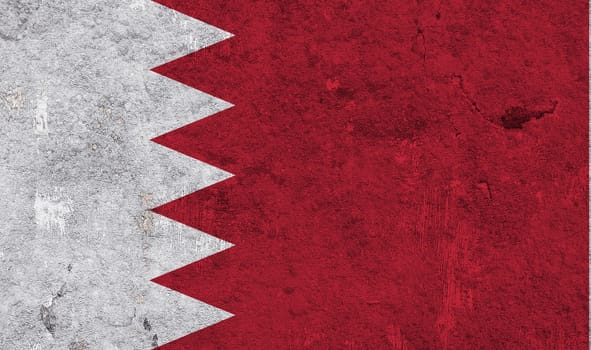 Flag of Bahrain on weathered concrete