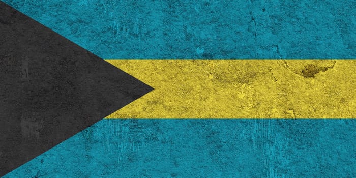 Flag of Bahamas on weathered concrete