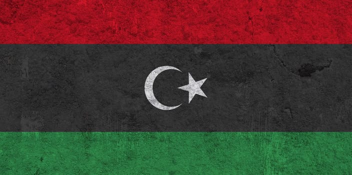 Flag of Libya on weathered concrete