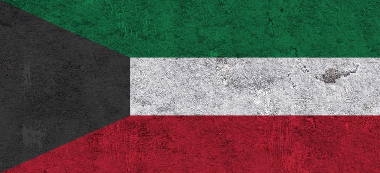 Flag of Kuwait on weathered concrete