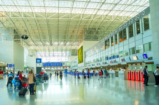 FRANKFURT, GERMANY - AUGUST 29, 2018: People at Frankfurt am Main airport hall. Frankfurt Airport is the busiest airport by passenger traffic in Germany as well as the 4th busiest in Europe