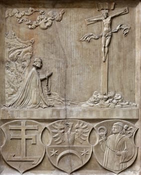 An old crucifixion relief sculpture outside St. Stephen's Cathedral in Vienna, Austria