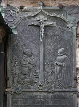 An old crucifixion relief sculpture outside St. Stephen's Cathedral in Vienna, Austria