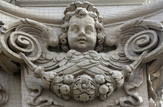 Angel on the facade of Dominican Church in Vienna, Austria