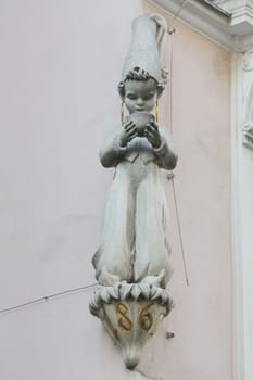 Architectural artistic decorations on facade of house in Vienna, Austria