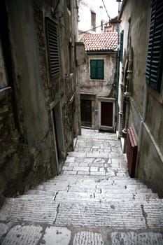 Narrow and old street in Sibenik city, Croatia, medieval zone
