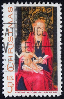 Christmas stamp printed in USA shows draw by artist Memling - Madonna and Child, circa 1982