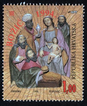 Christmas stamp printed in the Croatia shows birth of Jesus Christ, adoration of the Magi, circa 1994