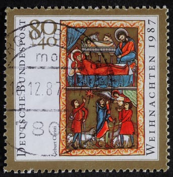 Christmas stamp printed in the Germany shows birth of Jesus Christ, adoration of the Shepards, circa 1987