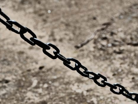 black iron chain diagonally concept of no freedom, oppression