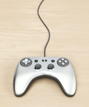 Wired game controller on wooden table