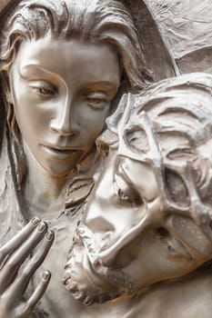Jesus Christ and Virgin Mary bronze statue. Jesus died in the arms of the Madonna.