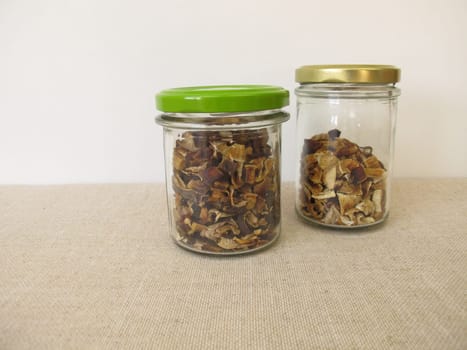 Dried mushrooms in a glass, bay bolete and porcino