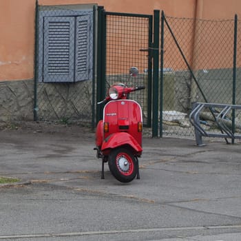 TURIN, ITALY - CIRCA SEPTEMBER 2020: red Italian Piaggio Vespa scooter motorcycle