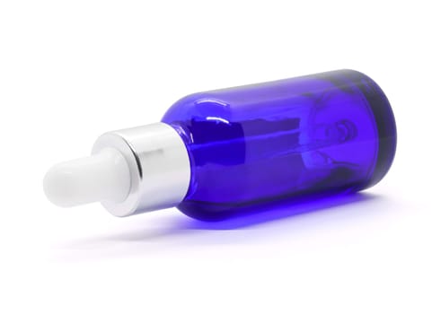 Blue glass dropper serum bottle on white background, Mockup for cosmetic product design