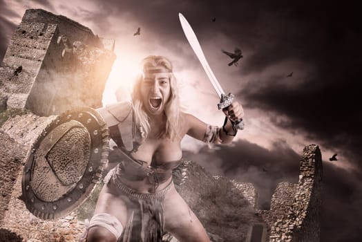 Ancient woman warrior or Gladiator posing with sword and shield
