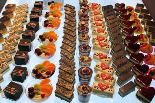 Colorful desserts and pastry served on a wedding party