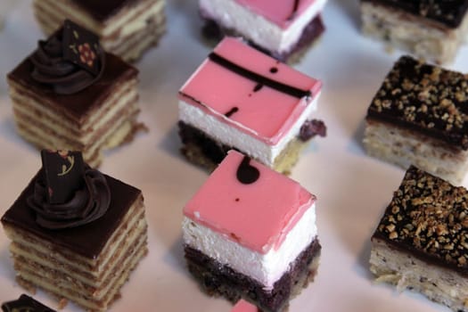 Colorful desserts and pastry served on a wedding party