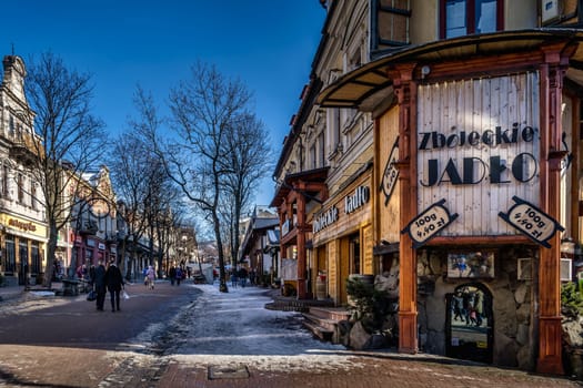 Zakopane, Poland, March 2019 Famous Krupowki promenade, main shopping area in Zakopane. Winter time. Zakopane is called a winter capital of Poland