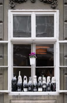 Window of restaurant with wine bottles in Zagreb, Croatia