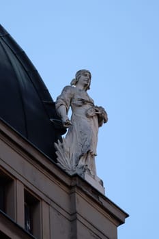 Statue on top of the old city buildings on Ban Jelacic Square in Zagreb, Croatia
