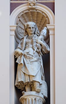 Statue on facade of the old city building in Zagreb, Croatia