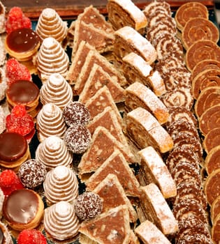 Colorful desserts and pastry served on a wedding party