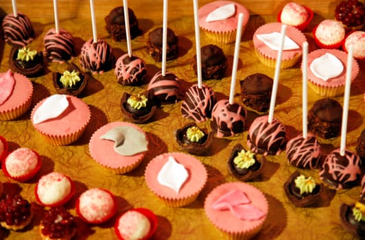 Colorful desserts and pastry served on a wedding party