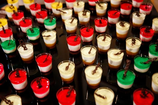 Colorful desserts and pastry served on a wedding party